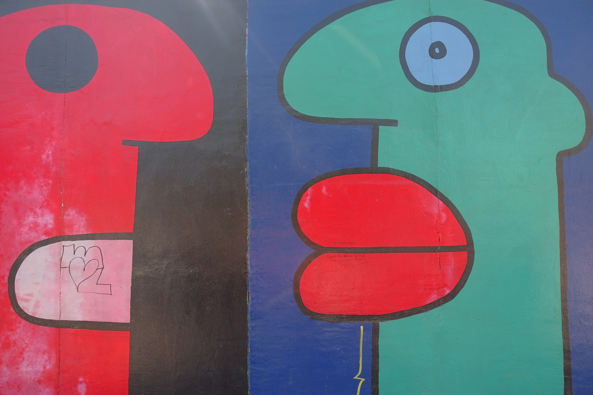 part of a mural on Berlin Wall, Eastside gallery, large faces by Thierry Noir 