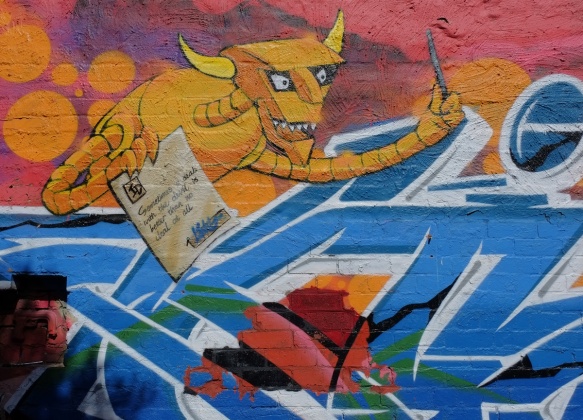 futurama devil in a mural, yellow colour, blue text graffiti, devil is holding a hand written paper that says sometimes a deal with the devil is better than no deal at all 