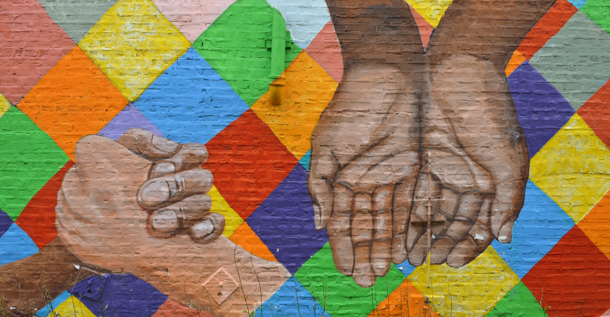 hands in a mural called hands in unity