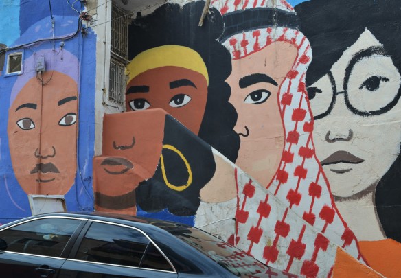 mural of large faces of different colours, 