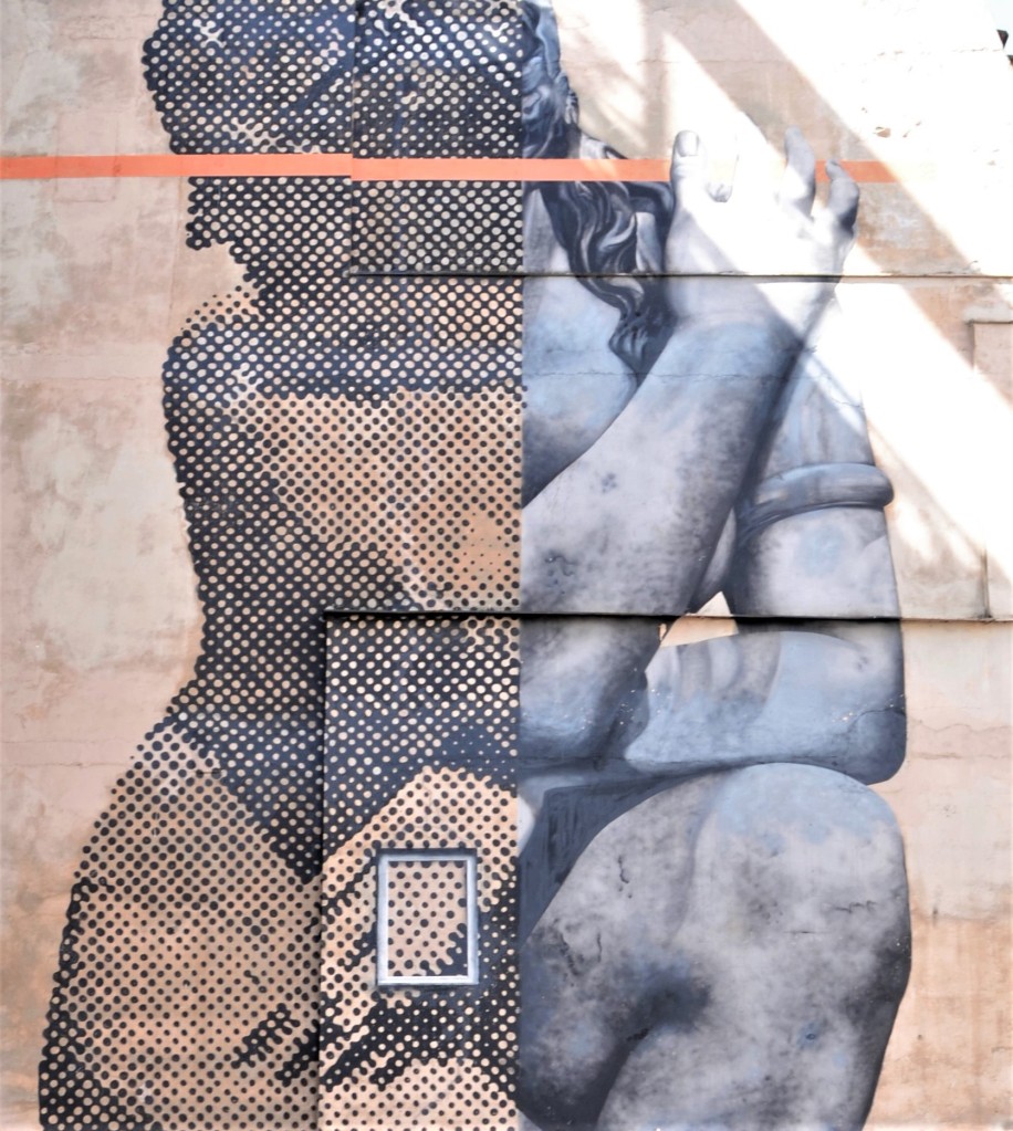 large mural of a statuesque woman