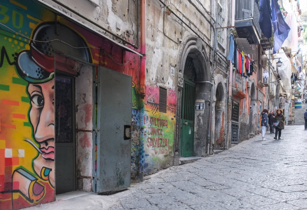 mural tributes to Italian actor Antonio de Curtis, or Toto, in an alley in the old part of Naples, 