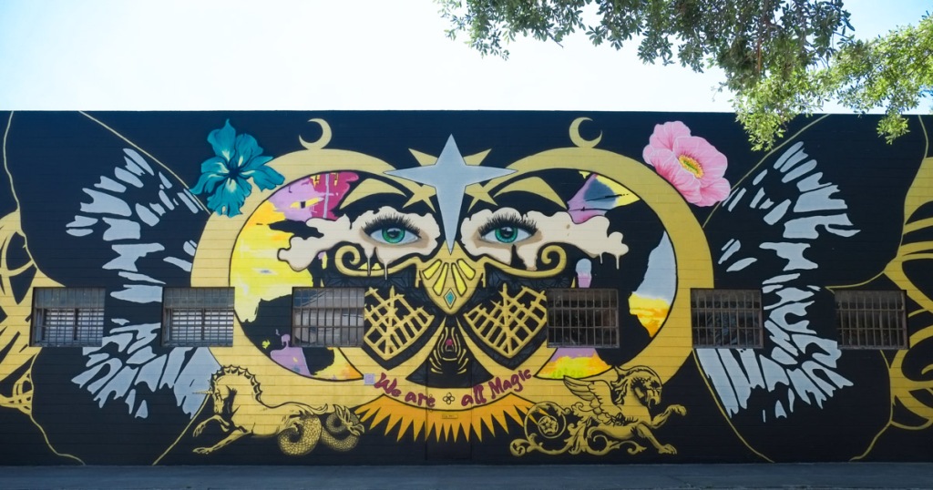 mural by sarah sheppard, eyes, butterfly, text that says we are all magic