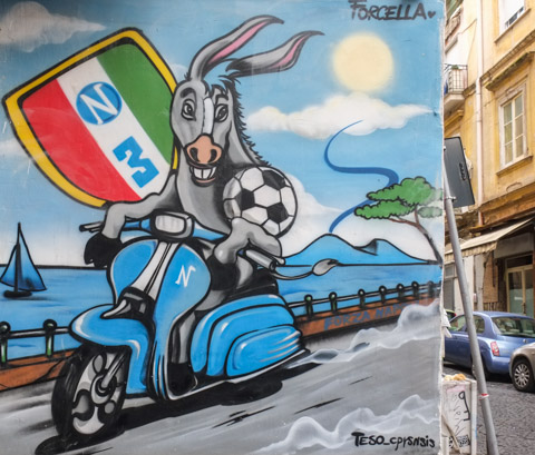 diego maradona themed street art in quatieri spagnoli in naples napoli, donkey on a motor scooter
